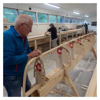 Kai planing the keel of the Finnia Canoe