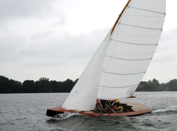 Sailing boat under sails