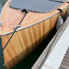 The Bluetree 5 electric motorboat in the water front view