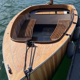 The Bluetree 5 electric motor boat in the water front view